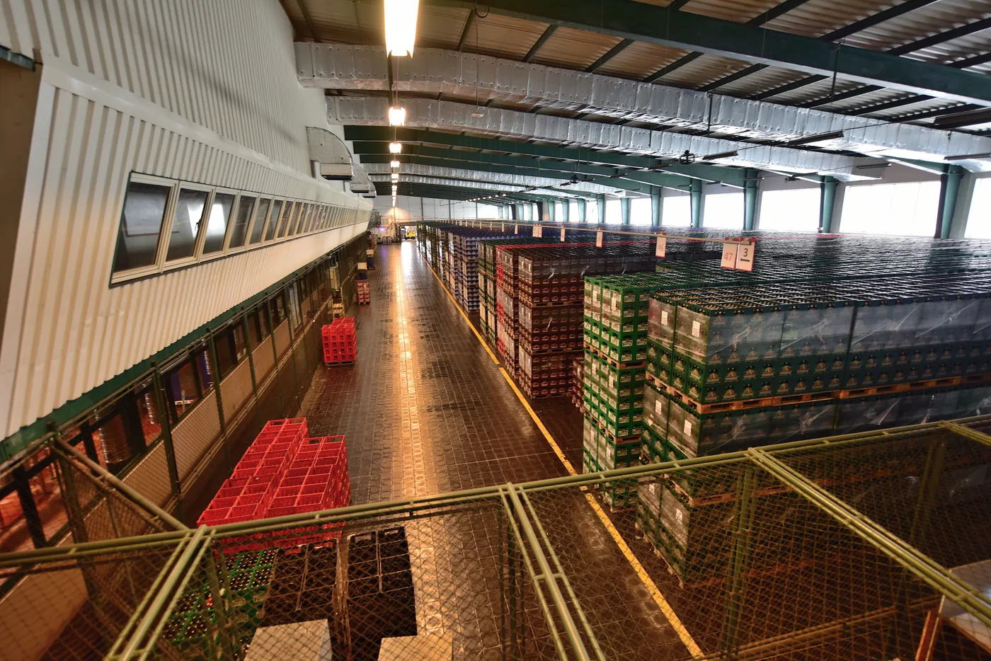 Warehouse interior with stacked storage racks used for supply and distribution